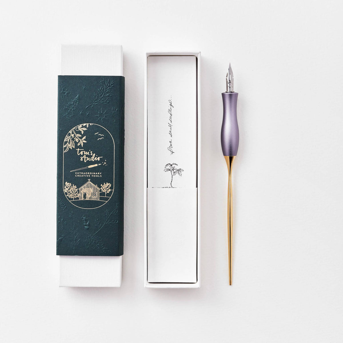 Lavender calligraphy pen with gold grip, shown with boxed case and tray