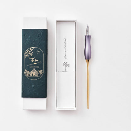 Lavender calligraphy pen with gold grip, shown with boxed case and tray