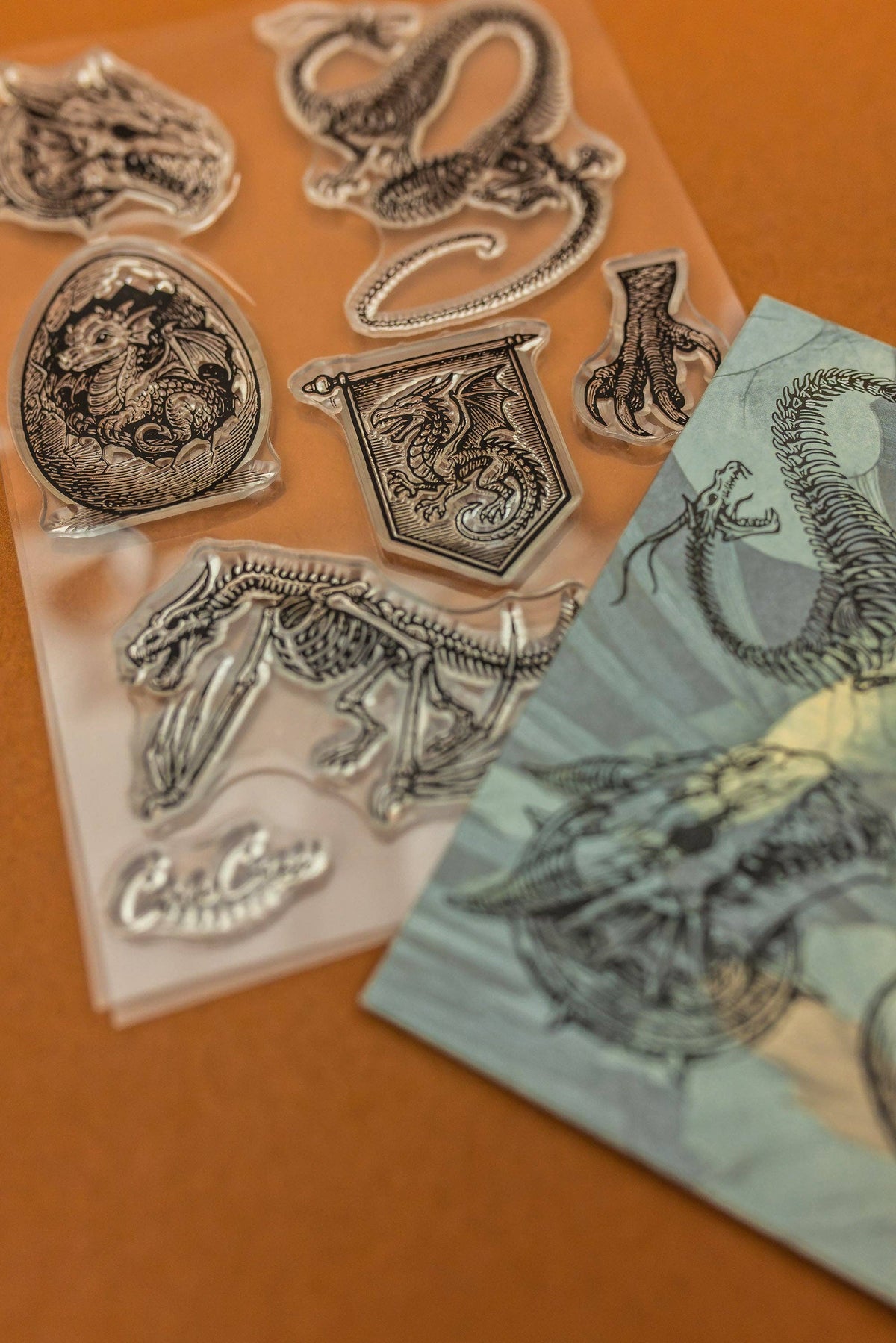 Clear stamps with dragon, snake, medallion, and banner icons with scalloped details