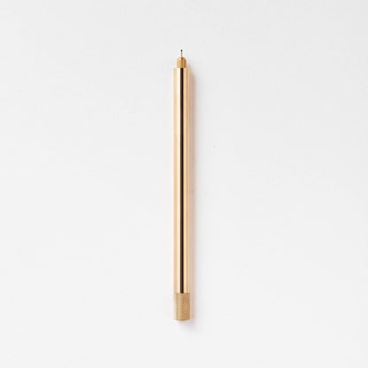 Brass metal pen with pointed nib and ribbed grip band