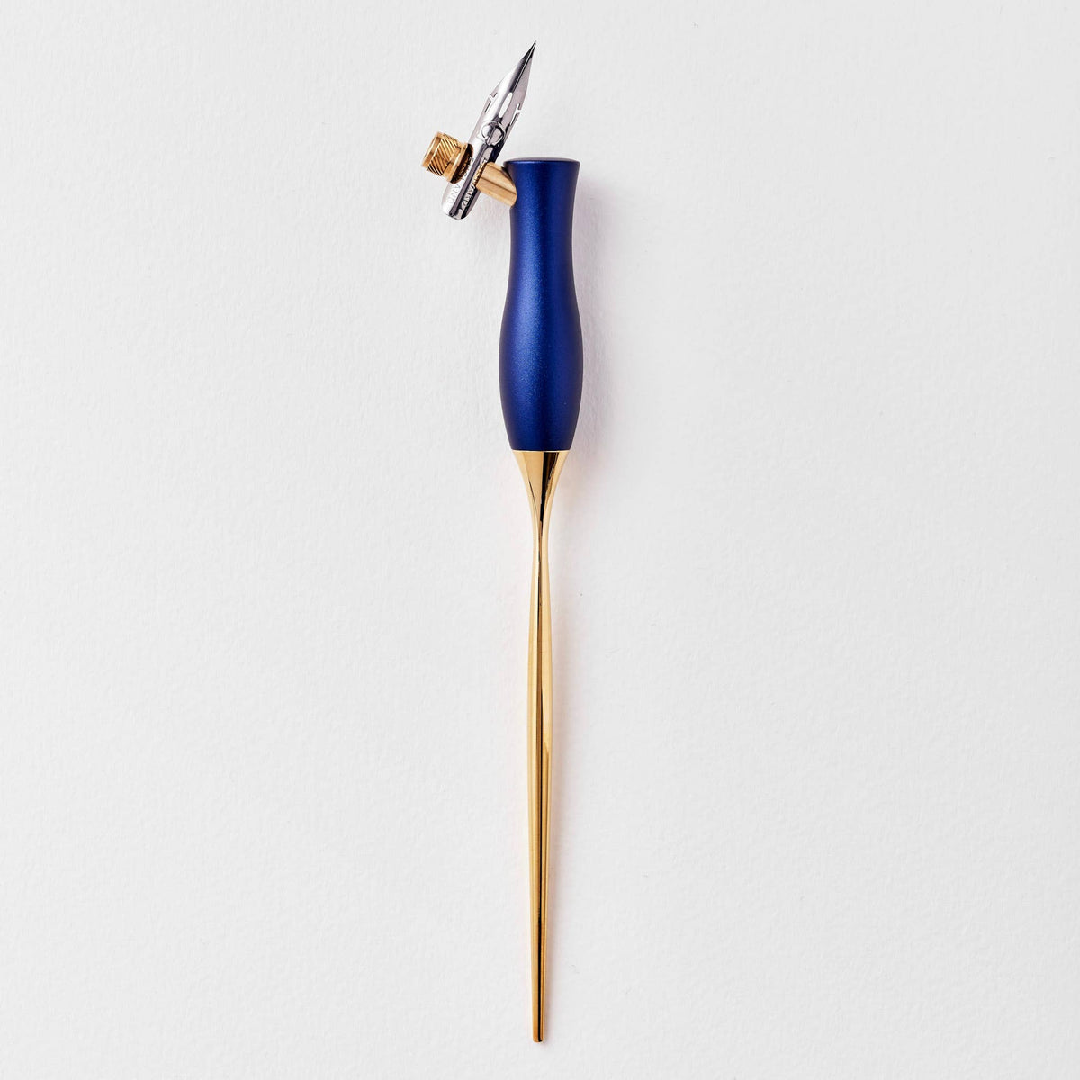 Blue calligraphy pen with oblique nib and gold accents, upright view