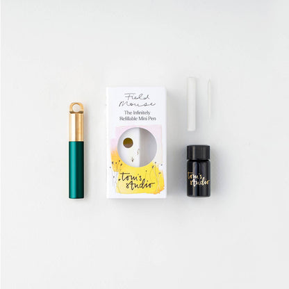 Midnight refillable travel pen kit with box, spare parts, and black ink bottle
