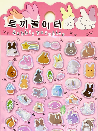 Rabbit paradise kawaii sticker sheet with shiny bunny, heart, and food shapes on pink