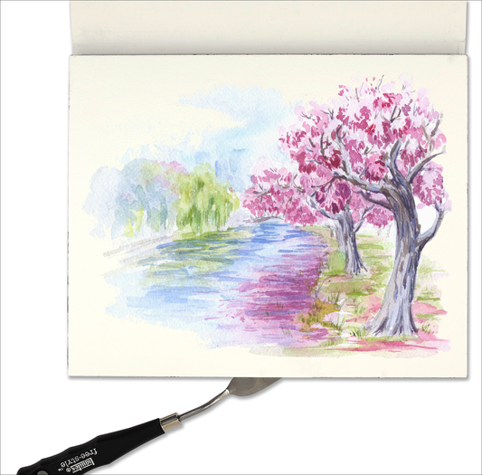 Watercolor paper block with landscape watercolor sample sheet and top backing sheet