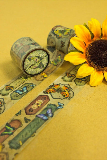 Butterfly washi tape roll with illustrated butterflies, moths, and insects on the strip