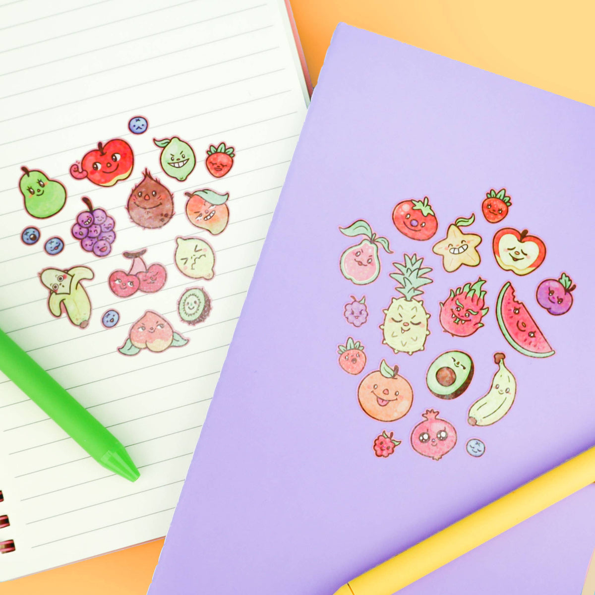 Lavender fruit sticker sheet with kawaii faces laid over lined notebook