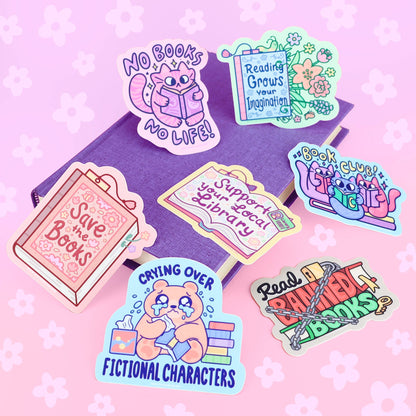 Set of bookish cat vinyl stickers with colorful book and reading designs