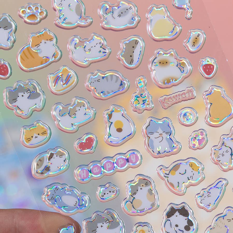 Close-up holographic sticker sheet with cat and heart shapes in iridescent outlines