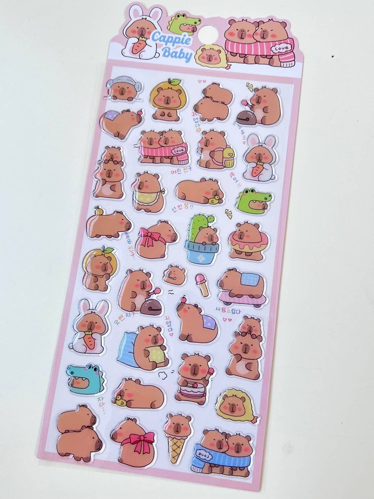 Pink Capybara Baby sticker sheet featuring capybara and bunny character stickers