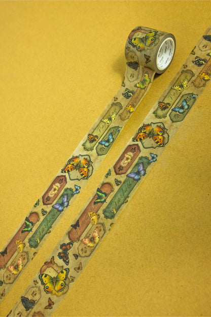 Butterfly washi tape roll showing a long strip of repeating owl, butterfly, and insect icons