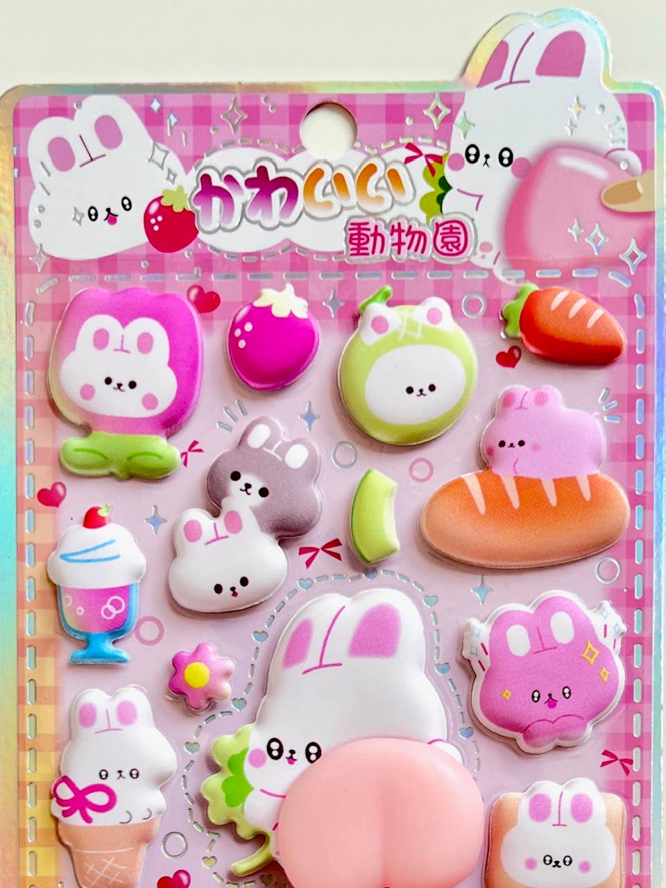 Pink animal squishy butt sticker set with white rabbits, cats, and candy details