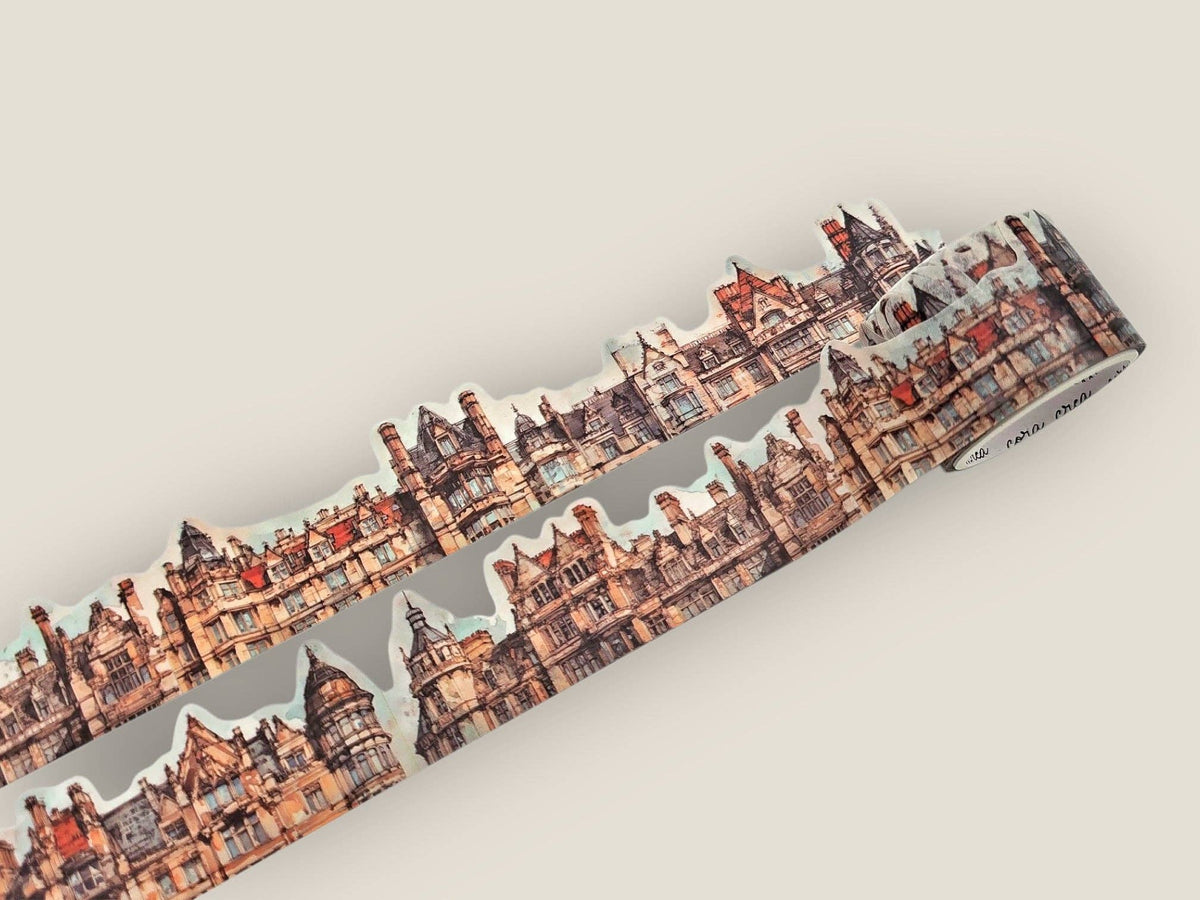Decorative cutout tape with repeating city skyline pattern and white cutout accents