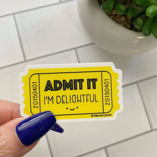 Yellow ticket vinyl sticker with black "ADMIT IT" and "I'M DELIGHTFUL" text