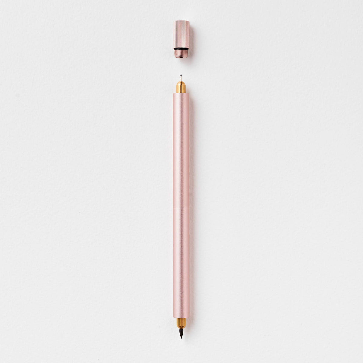 Refillable multi-tip pen, pale pink body with gold nib and pink cap