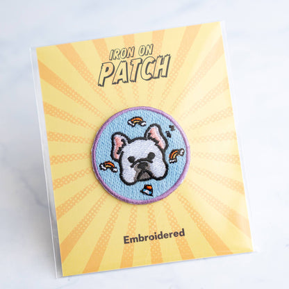 Round embroidered dog iron-on patch with light-blue cartoon dog face on blue