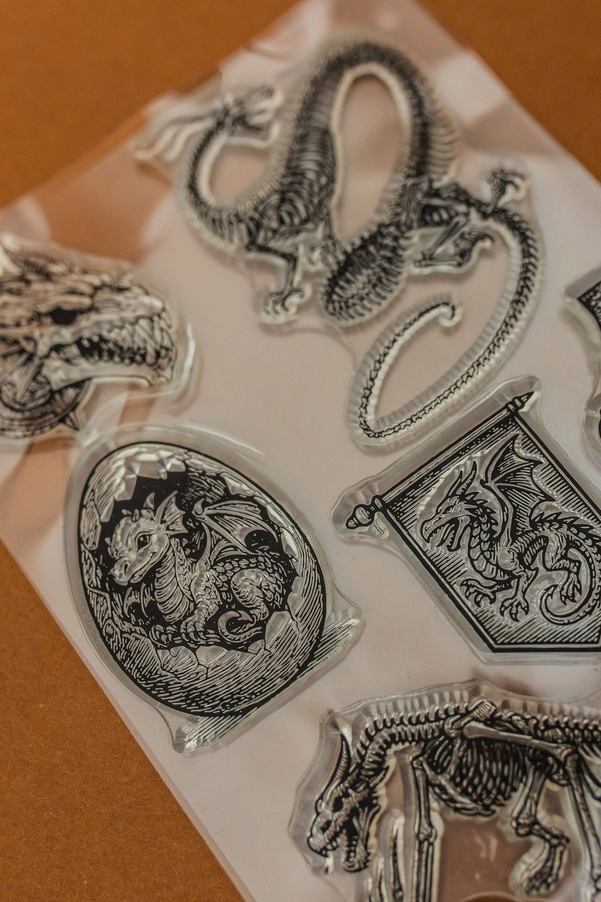 Close-up clear rubber stamps with dragon, serpent, and coin medallion designs