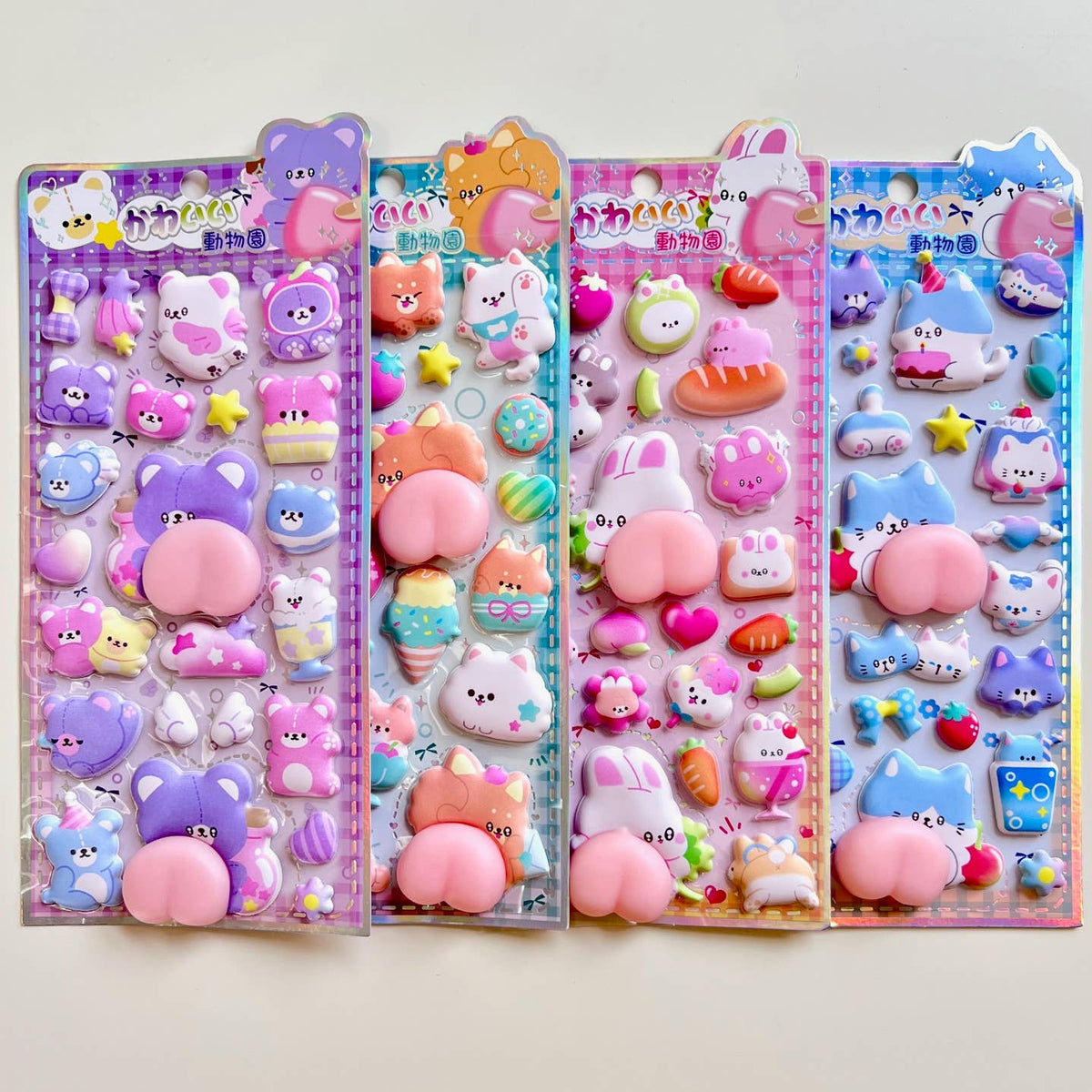 Animal squishy butt sticker set with four card panels of cute pastel animal face and squishy shapes