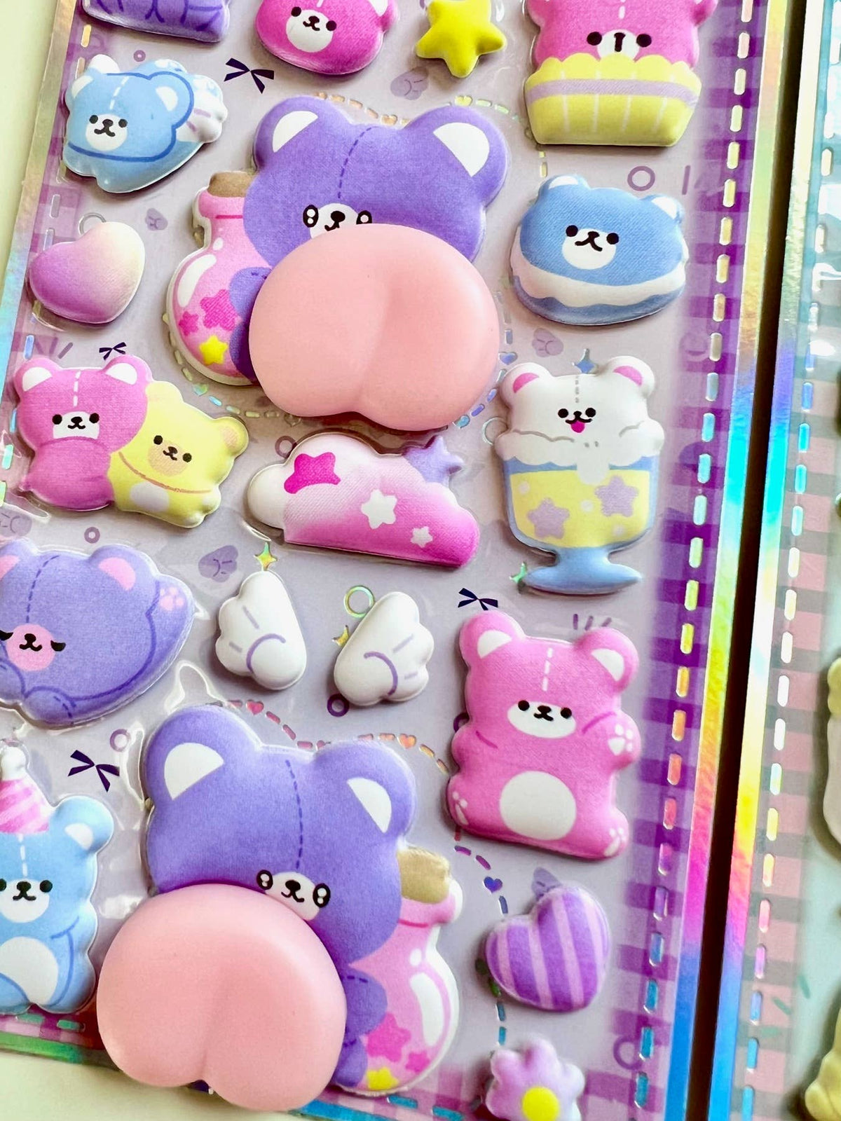 Purple and blue animal squishy butt sticker sheet with bear and cat face accents
