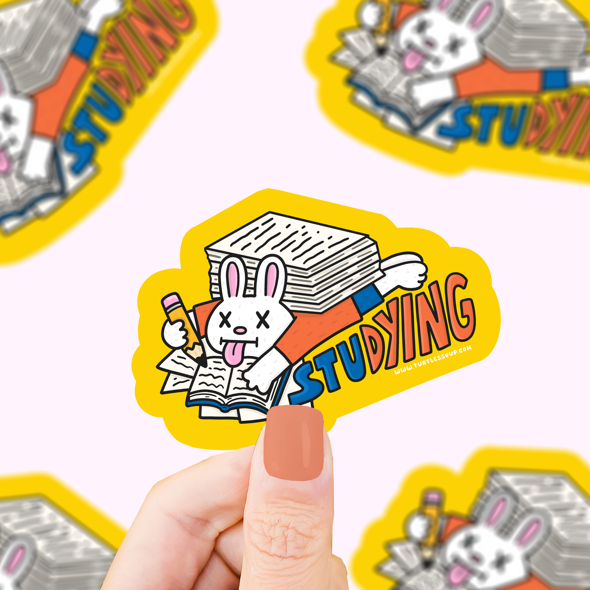 Vinyl bunny studying rabbit sticker, open book with text and orange star outline