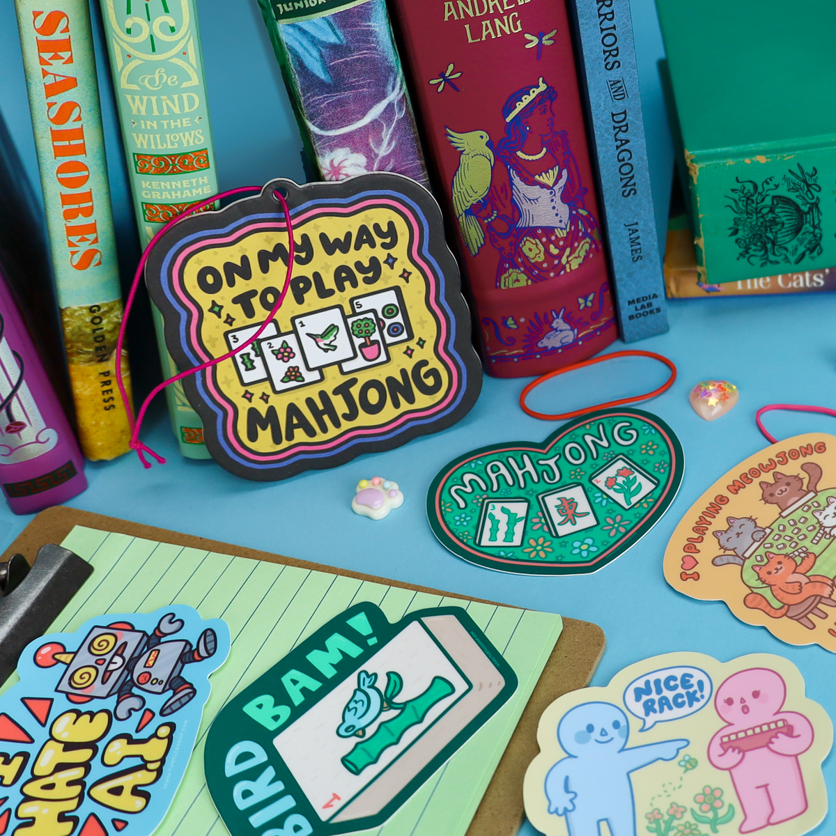 Mahjong-themed vinyl sticker set with game text and cartoon icons, on a tabletop