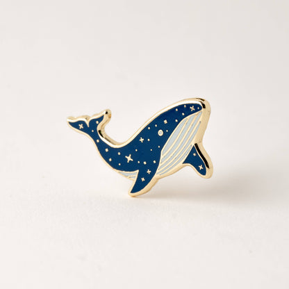 Blue whale enamel lapel pin with gold outline and star details