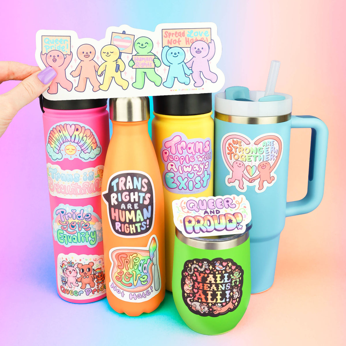 Strip of LGBTQ pride vinyl stickers with rainbow character designs and slogan icons