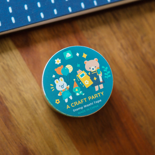 Round washi tape roll showing smiling characters with stamps on blue teal label