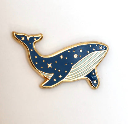 Blue whale enamel lapel pin with white belly and gold border