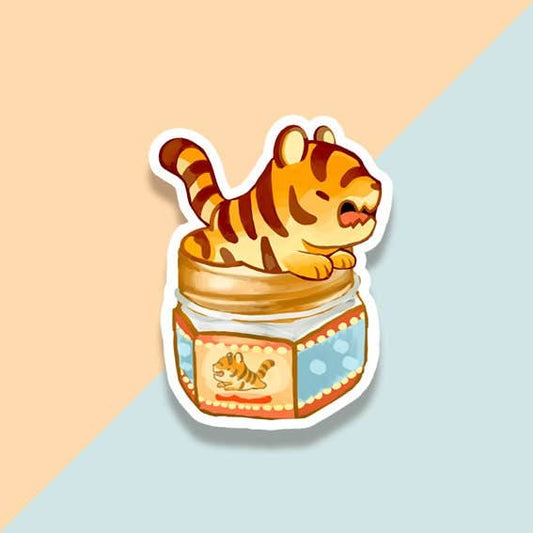 Tiger cub in jar vinyl sticker, cartoon orange tiger with white belly and blue jar