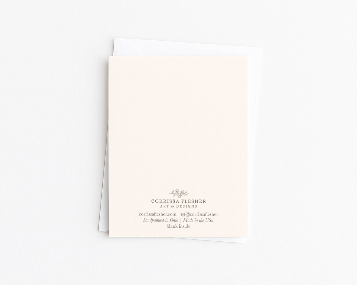 Christmas card back with Corrissa Flesher branding and message, blank inside