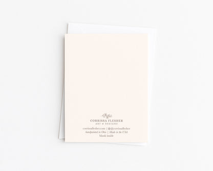 Christmas card back with Corrissa Flesher branding and message, blank inside