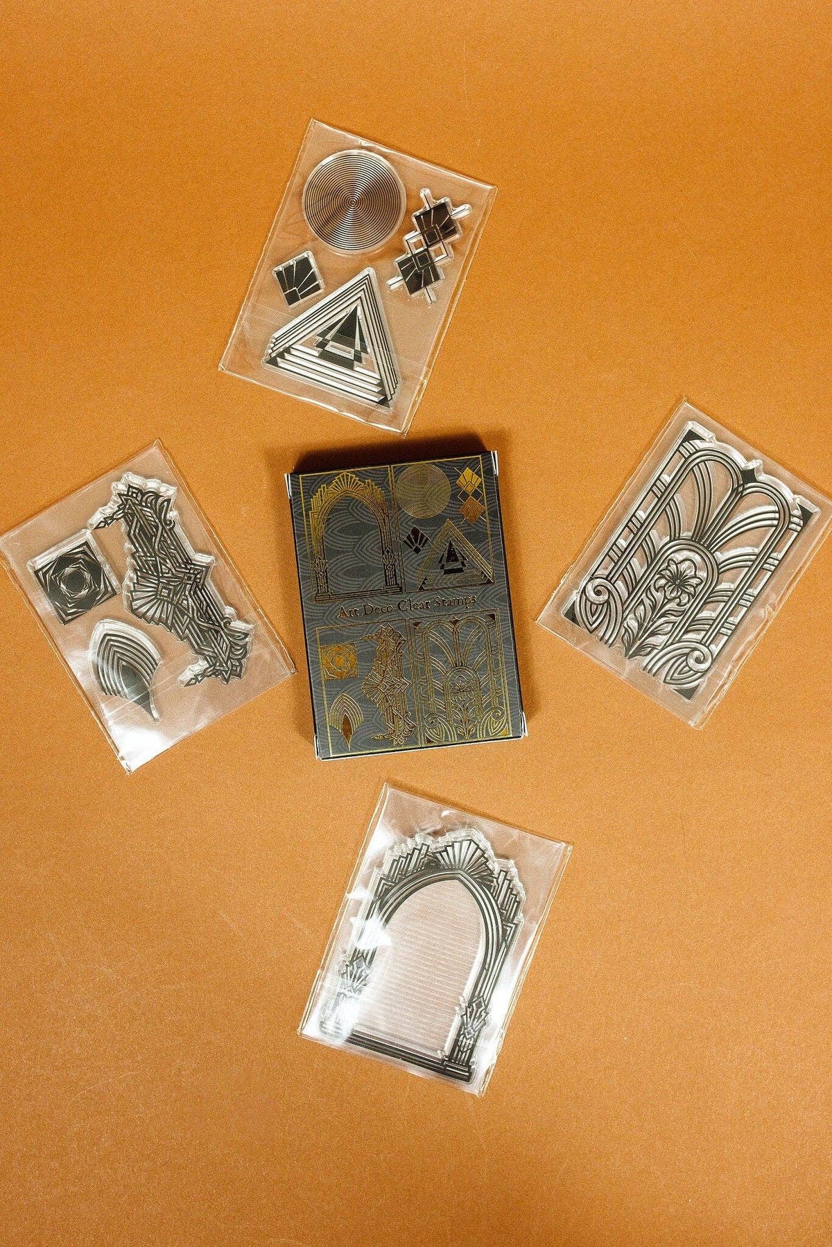 Clear art deco stamp set with geometric and arch designs on individual plastic sheets