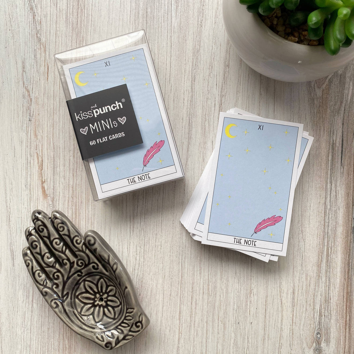 Tarot card mini notecards in a clear 60-card case, with a moon, stars and feather design.