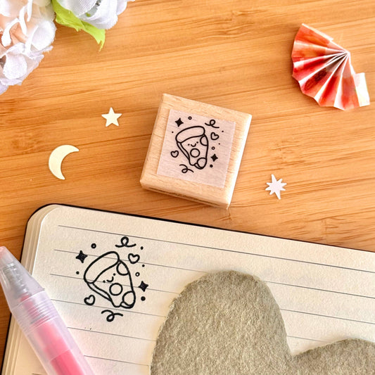 Wooden pizza stamp with black pizza doodle on square block