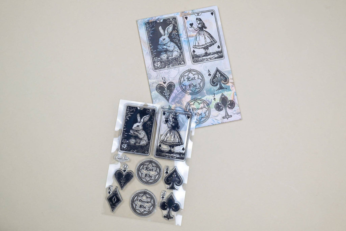 Two clear stamp sheets with rabbit and dress designs, clock faces, hearts and spades