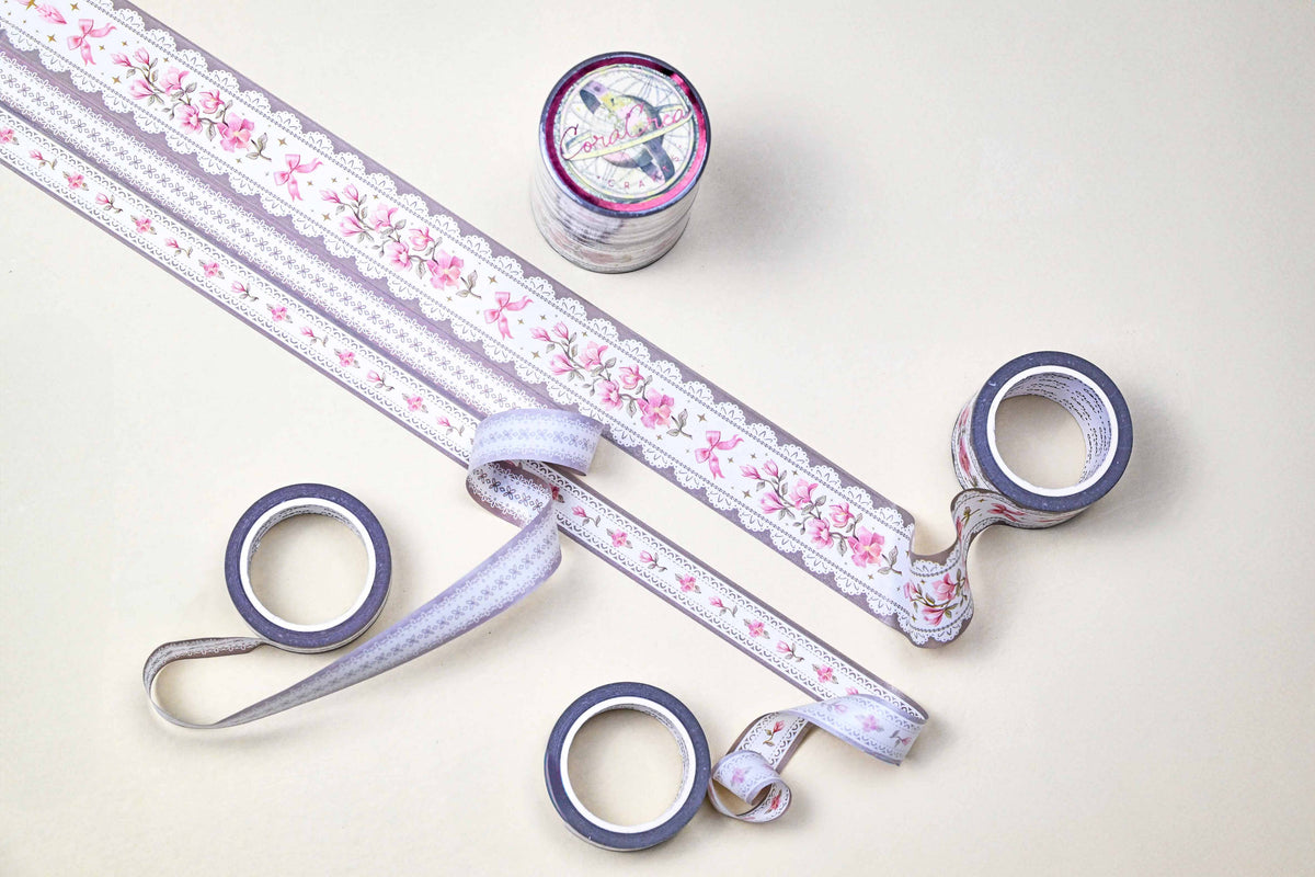 Washi tape set with floral border patterns and flower motifs, rolls and loose strips