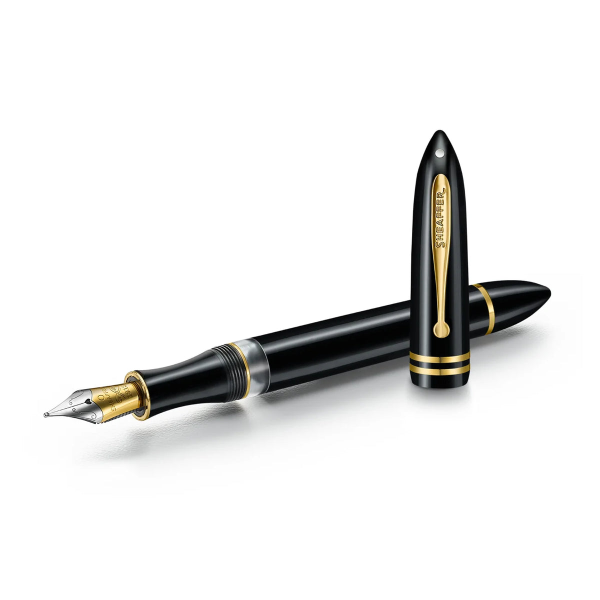 Black fountain pen with gold accents and exposed nib tip