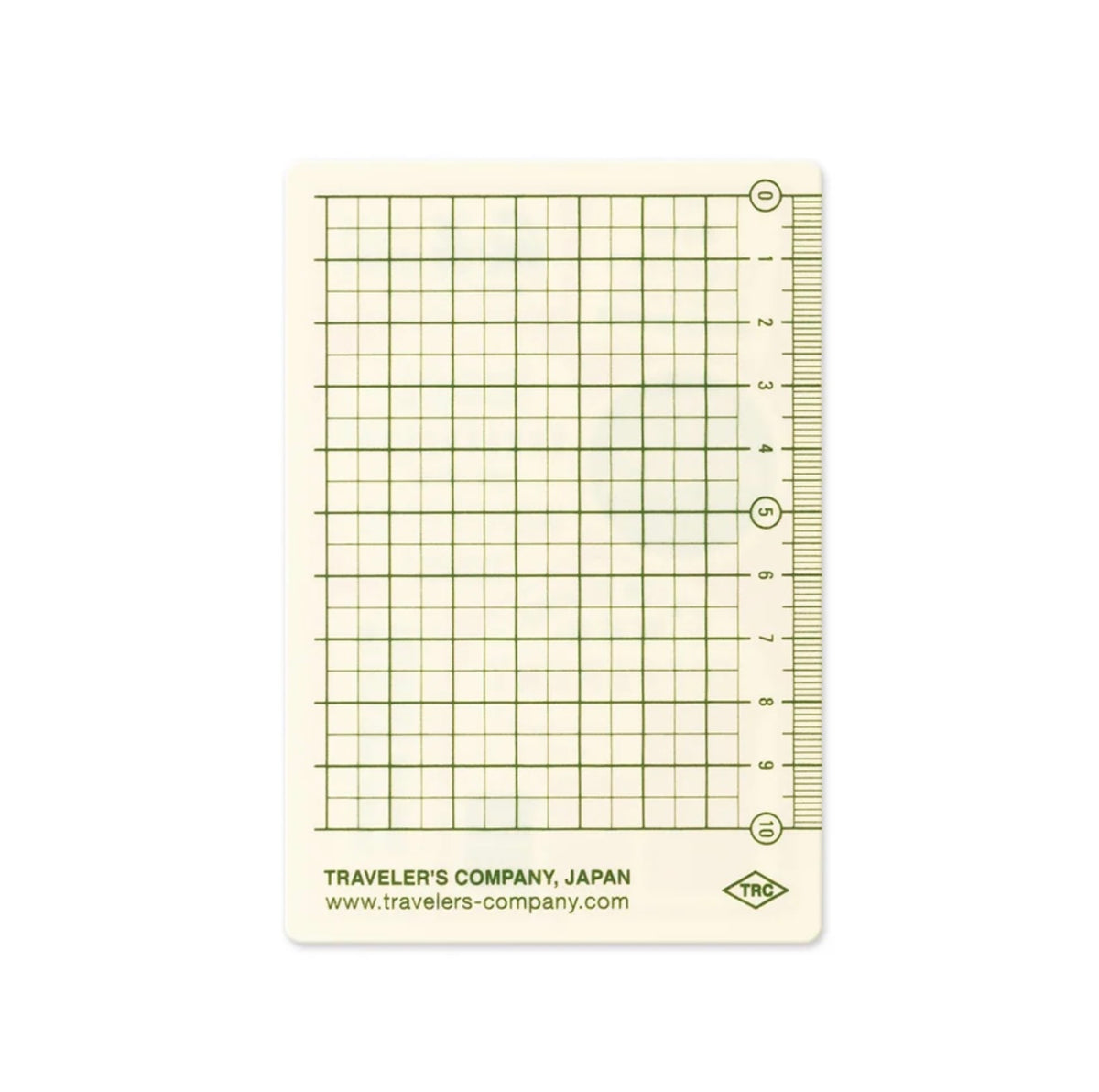 Passport-size plastic pencil board with a green grid and measuring rulers