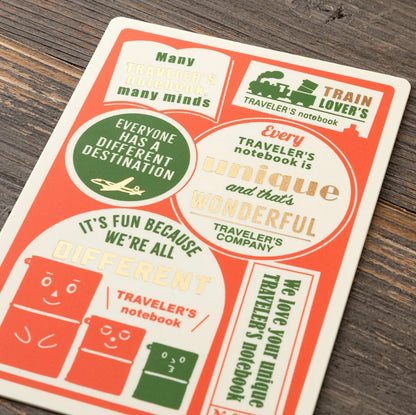 Passport-size plastic pencil board with orange, green, and cream travel-themed graphics