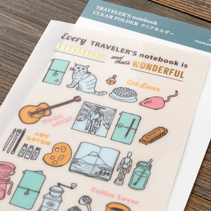 Close-up of the clear folder's colorful notebook-themed illustrations and rounded corner