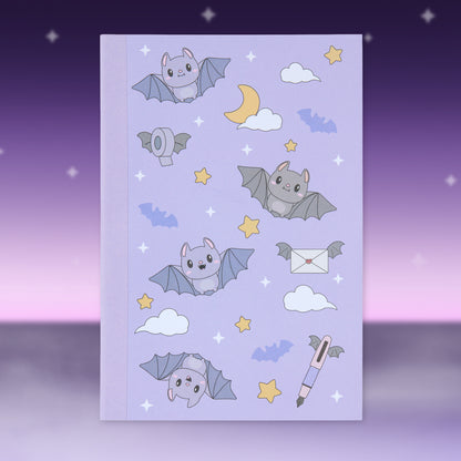 Blue Halloween patterned paper sheet with bats, ghosts, stars, and envelopes