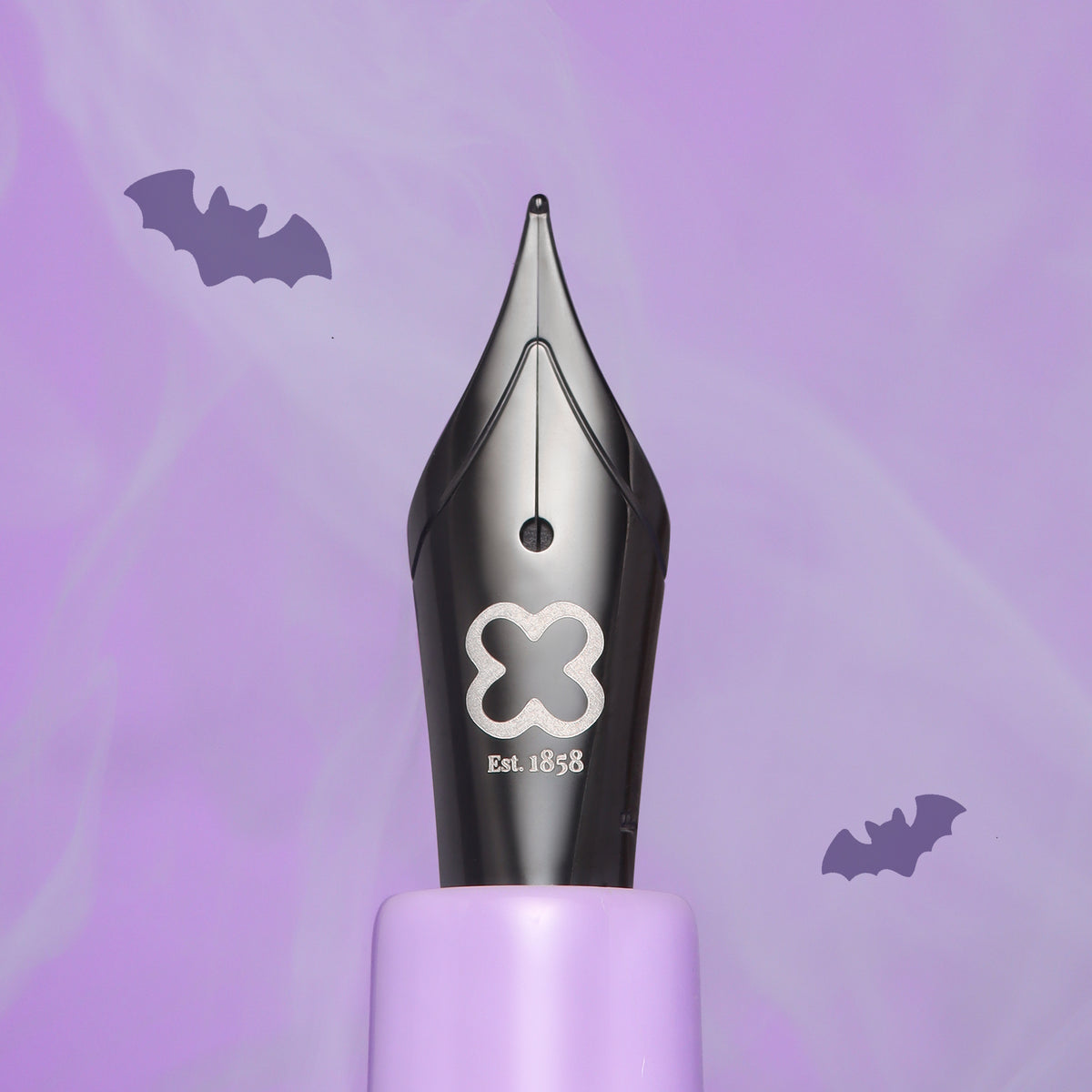 Black fountain pen with clover emblem on the barrel
