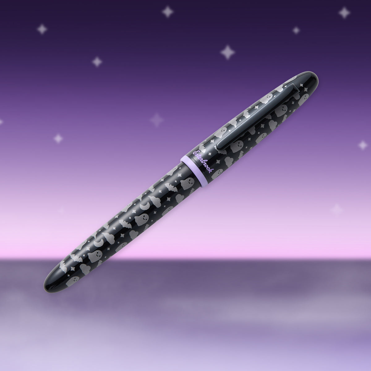 Black fountain pen with repeating skull and ghost pattern, angled view