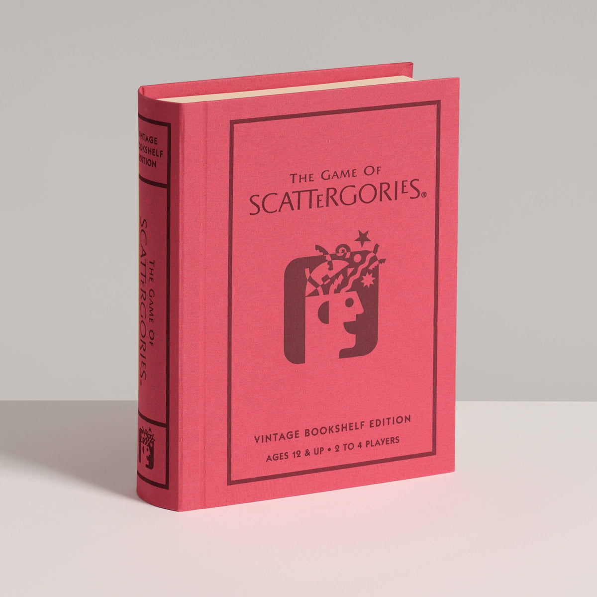 Vintage board game box with red cover, logo graphic, and title text