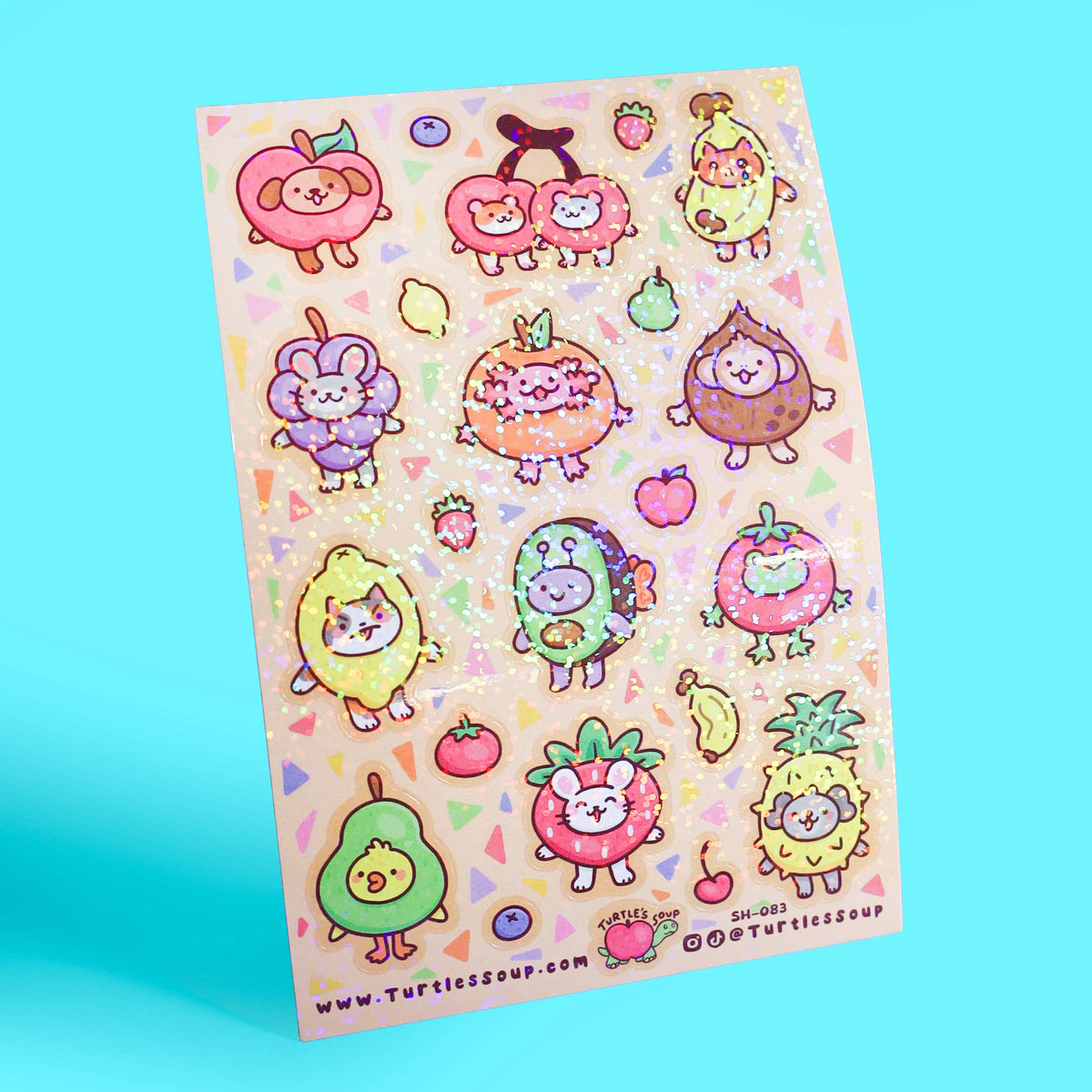 Glitter sticker sheet featuring round fruit-animal characters with colorful details