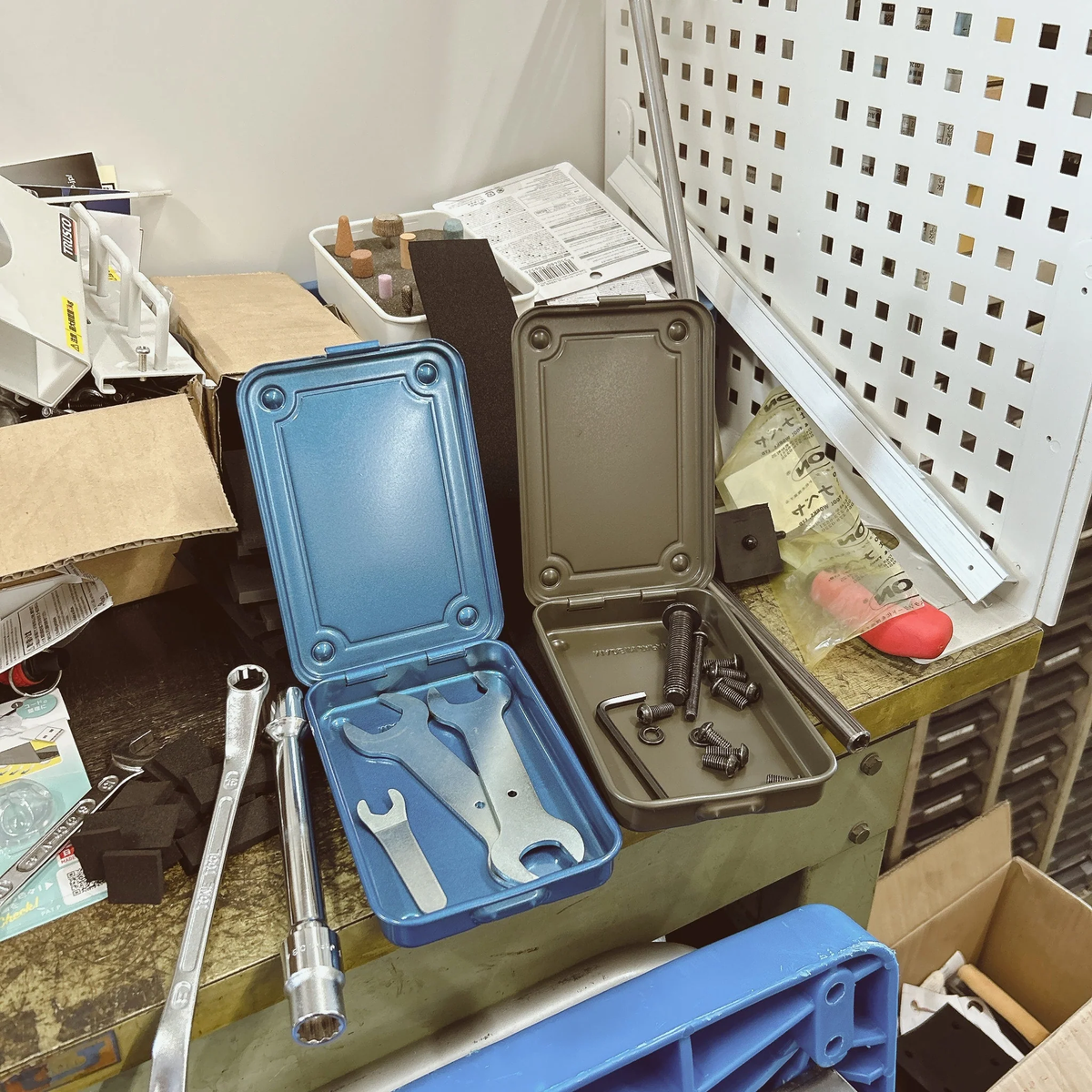 Open Toyo steel storage boxes holding wrenches and hardware