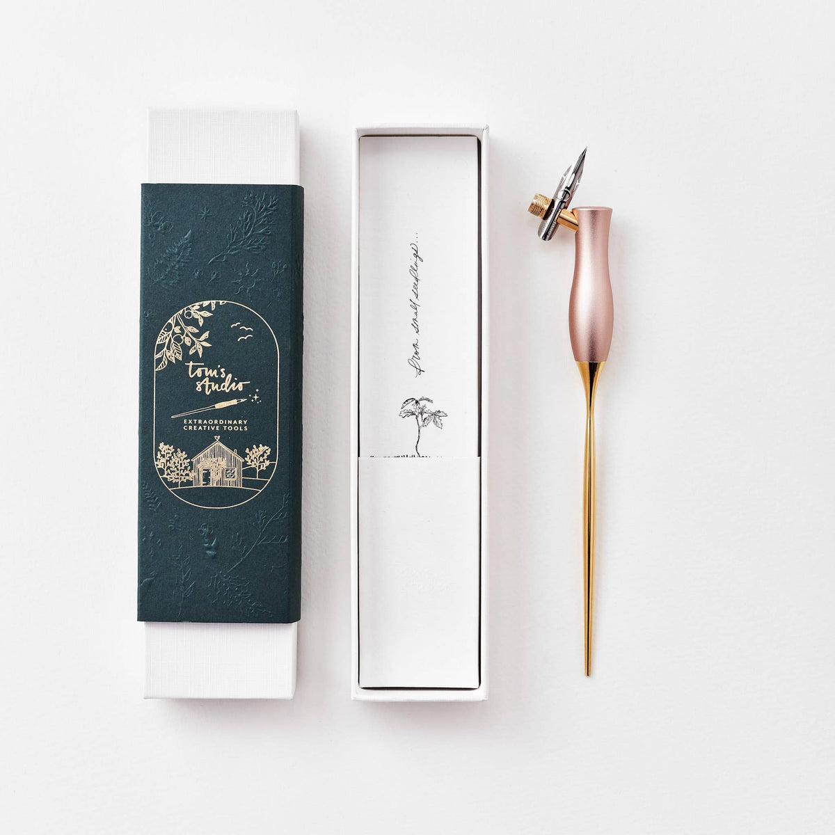 Pink calligraphy pen with oblique nib and gold accents, shown with gift box and sleeve