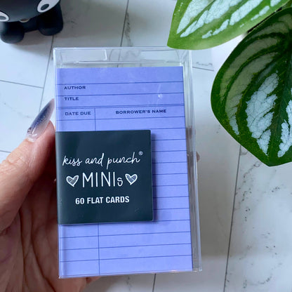Purple library card mini notecards in a clear case, showing borrower and due-date fields