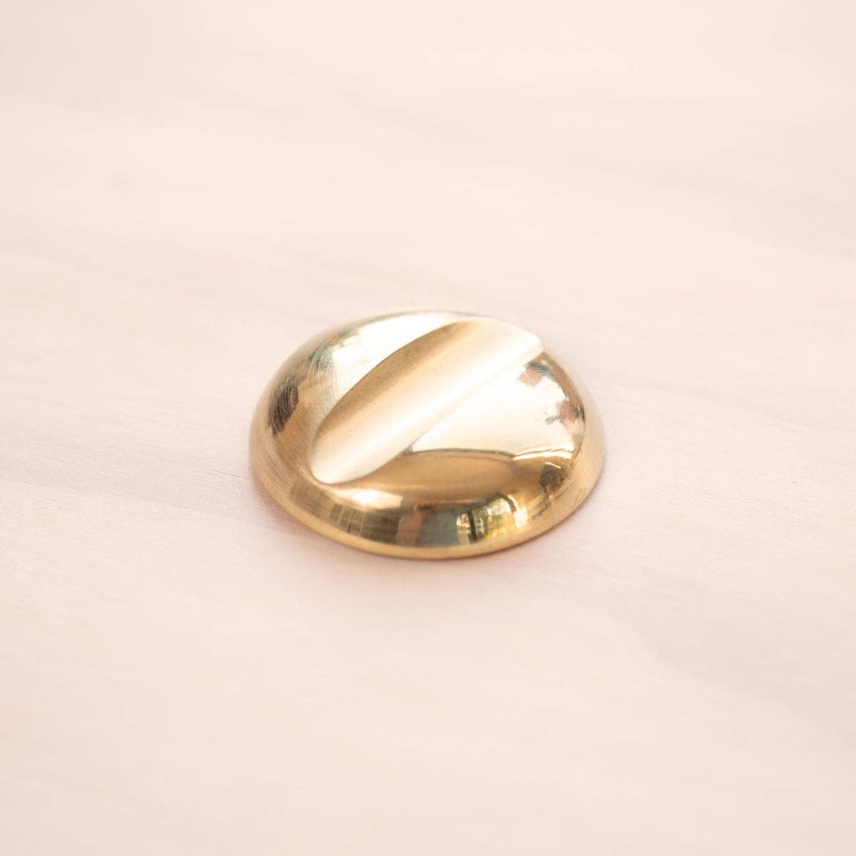 Solid brass pen rest with round domed base, polished gold finish