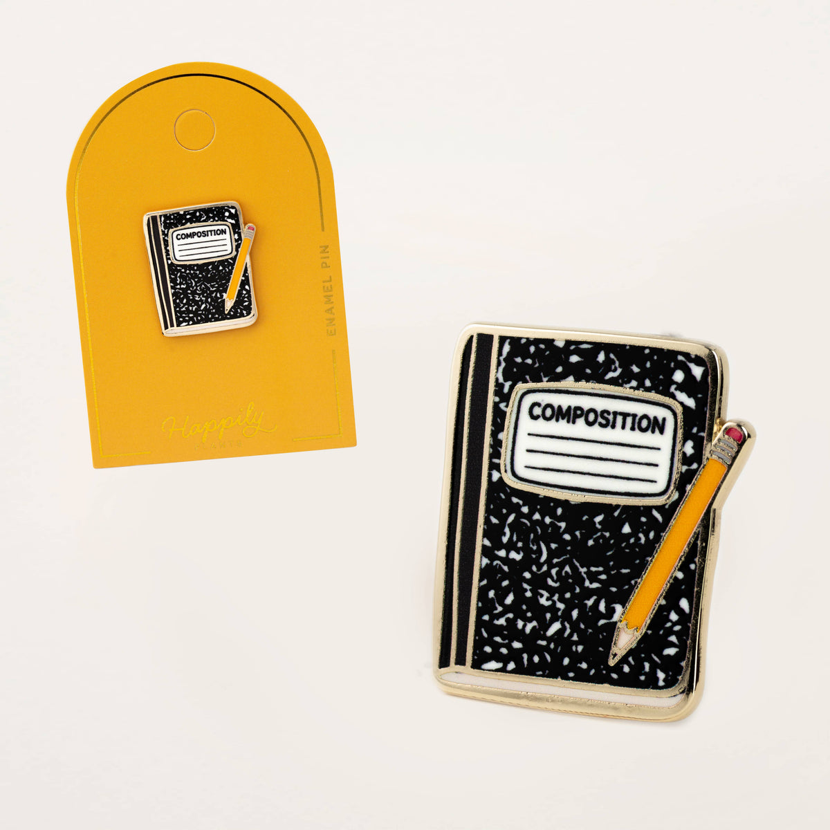 Enamel composition notebook pin and orange arched backing card shown side by side
